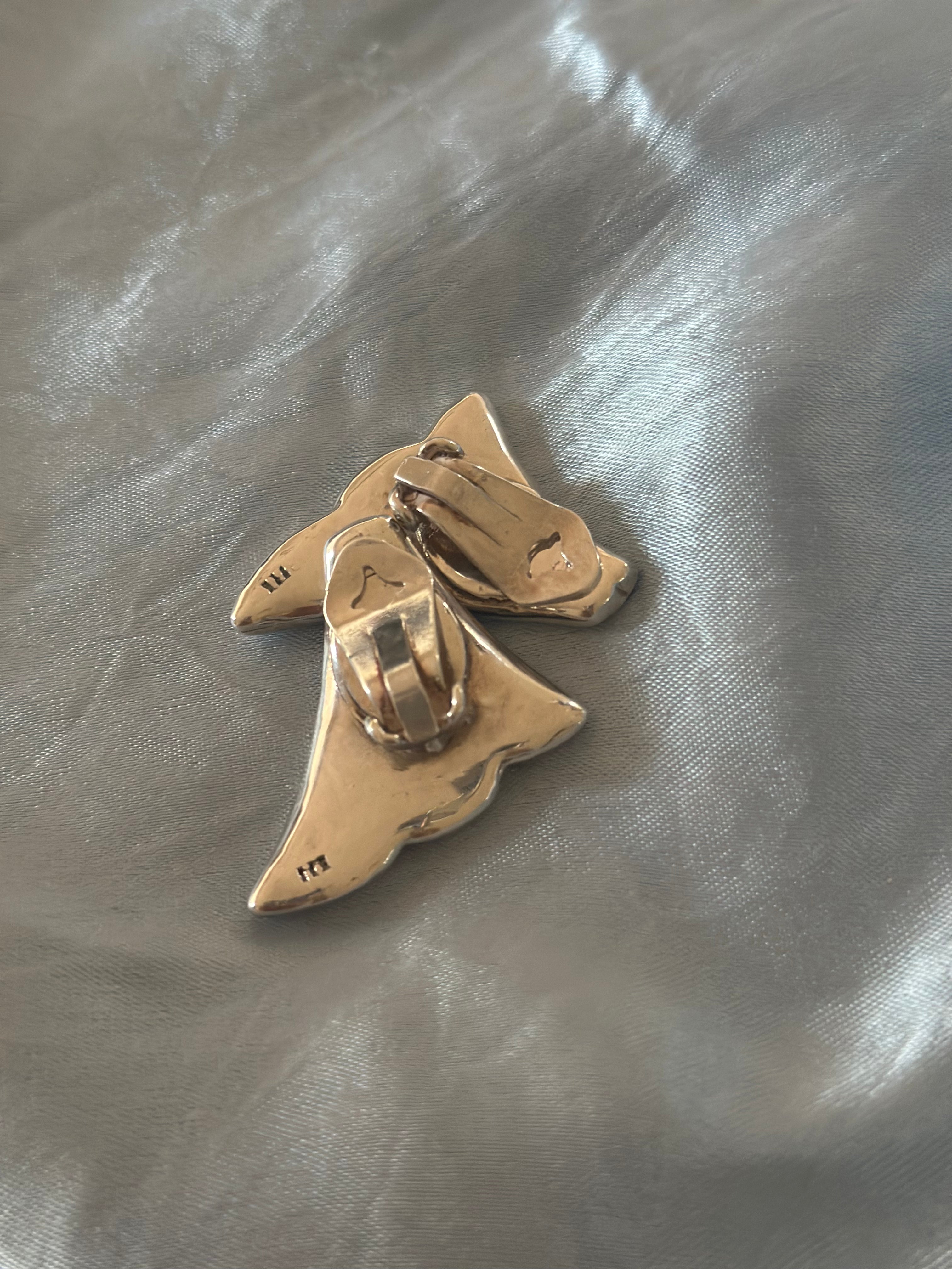 Silver wing clip on earrings